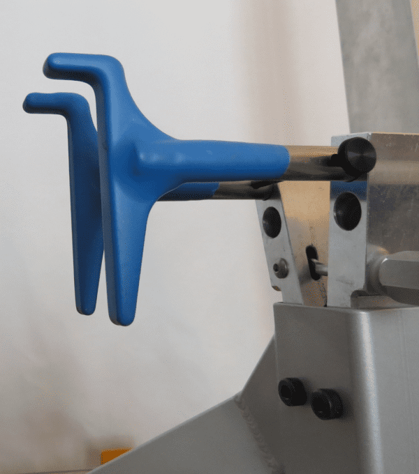 Blue Angled L Pins in a metal holder.