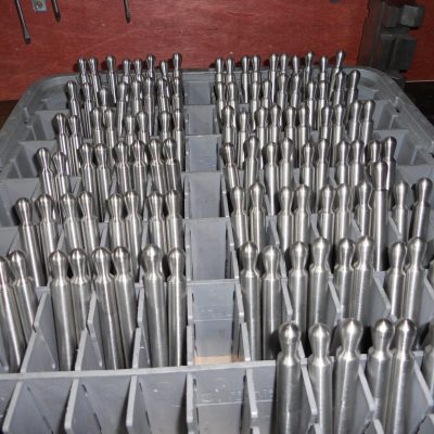 Manufacturing Spikepins in a plastic tray.